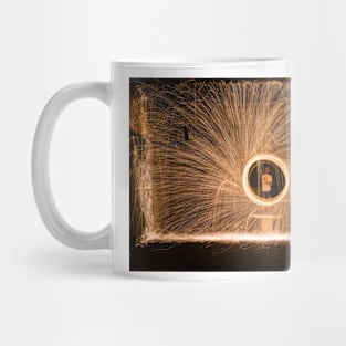 Yellow sparks in front of person in white top Mug